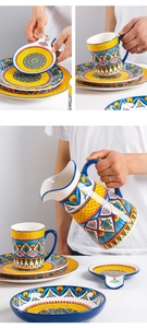 Detail of Mediterranean style ceramic tableware set with hand-painted patterns