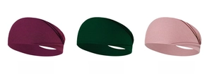 Detalle del tejido de las cintas elásticas deportivas en castaño, verde y rosa
