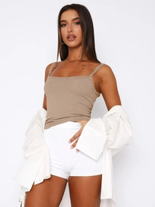 Detail of ribbed texture on brown slim fit tank top with lace trim and spaghetti straps
