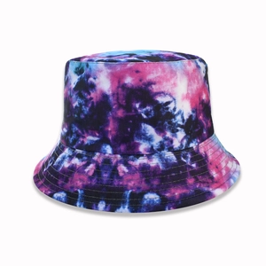 Foldable tie-dye bucket hat with pink purple and blue starry print on white background