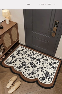 Close-up of French vintage PVC floor mat with rose pattern and scalloped edges