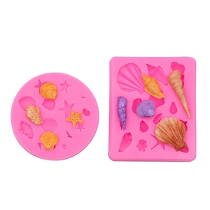 Pink silicone marine life fondant molds featuring seashells and starfish for cake DIY