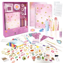 Detailed view of pink DIY journal set including notebook, stickers, tape and markers