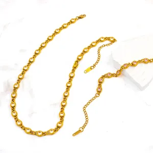 Detail of 18K gold plated necklace and bracelet set with colorful round cut cubic zirconia