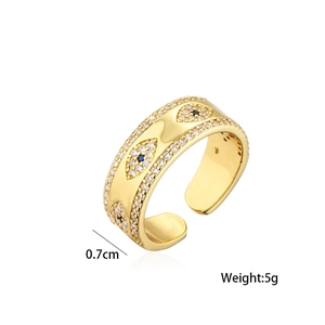 Golden evil eye open ring with blue zircon inlay on white background 0.7cm wide