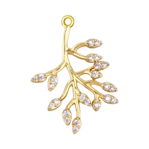 Macro shot of gold branch pendant with white zircons on a clean white background