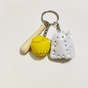 Detailed sports keychain featuring a mini wooden baseball bat, yellow ball and white glove