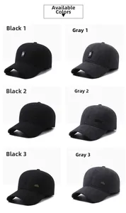 Detail view of winter baseball caps in black and grey with ear flaps and different metal logos