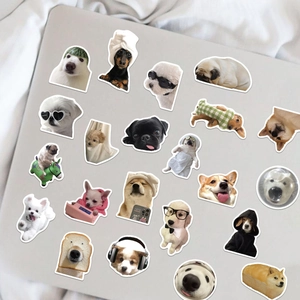 Funny realistic dog stickers set on a laptop featuring various breeds like Corgi and Husky