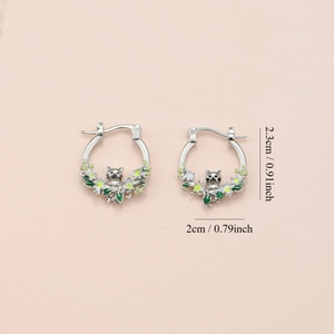 Cute raccoon and floral enamel hoop earrings in silver finish with leaf accents