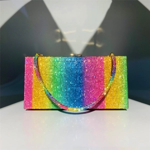 Detail of evening clutch bag with rainbow gradient rhinestones and matching crystal chain