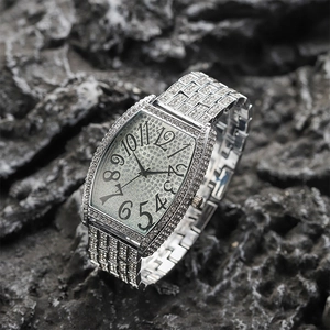 Elegant silver rectangle watch with crystal diamonds and numerals on a stone background