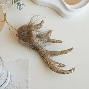 Sparkling gold reindeer antler hanging ornament with plush detail for Christmas tree decor