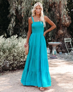 Detail of tiered lake blue sundress showing smocking bodice and vertical stripes