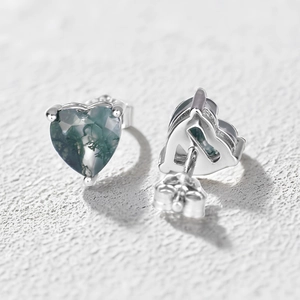 Macro shot of S925 silver heart studs with green moss agate and standard butterfly backs