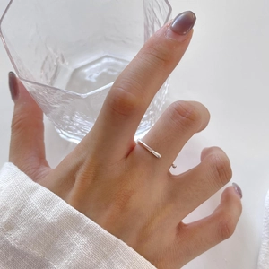 Macro detail of a 925 sterling silver irregular ring showing sleek polished finish