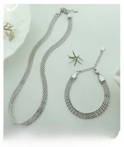 Detail of silver mesh woven necklace and bracelet set with lobster clasp and extension chain