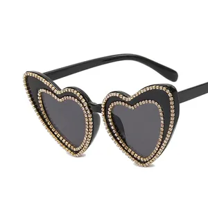Retro heart-shaped sunglasses for women featuring sparkling crystal rhinestone embellishments