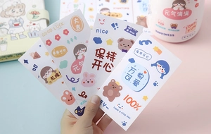Close-up of cute cartoon stickers with characters and text on pastel background