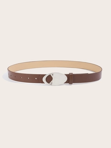 Close-up of brown leather belt with unique silver hollow geometric metal buckle