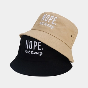 Black and beige cotton bucket hats with white NOPE not today embroidery text