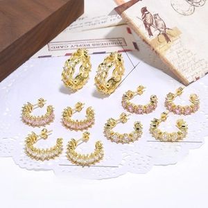 Detailed view of 18k gold plated hoop earrings with pink and clear zircon crystals