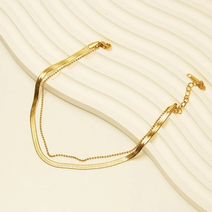 Double-layered 18K gold-plated titanium ankle chain with snake and bead design