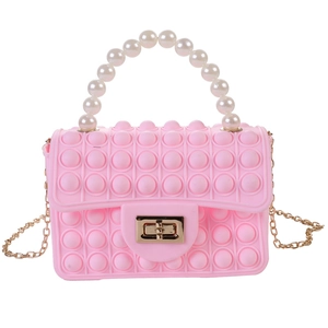 Pink silicone pop fidget crossbody bag with pearl handle and golden chain strap