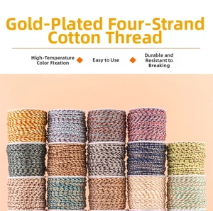 Macro view of four-strand twisted cotton cords with metallic gold thread for DIY jewelry