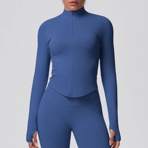 Detail of slim fit yoga jacket featuring thumb holes and ribbed side panels for flexibility