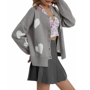 Grey knit cardigan featuring white heart patterns and button closure in a relaxed fit