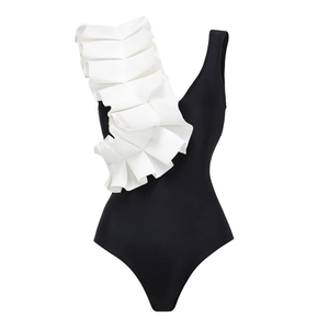 Detail of elegant black one-piece swimsuit with luxury white ruffled shoulder design