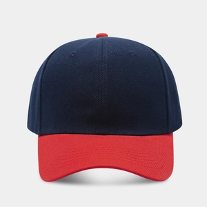 Detail of navy crown and red visor stitching on a twill cotton baseball cap