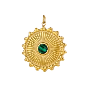 Detailed shot of a vintage gold sun pendant with a round green malachite stone center