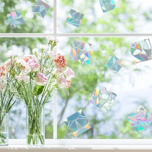 Rainbow prism static window film set of 12 creating colorful light patterns on a glass
