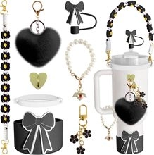 Detail view of DIY black floral lanyard and charms on white tumbler accessories set