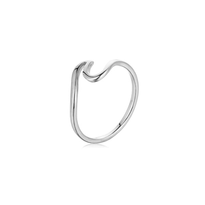 Macro shot of silver wavy stainless steel ring showing polished finish and smooth curves