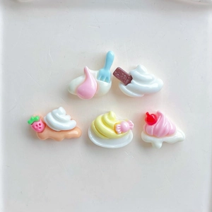 Five assorted mini resin dessert charms including ice cream and cake for DIY crafts