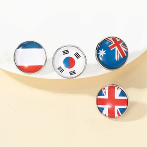 Detailed view of metal national flag badges including UK and Australian designs