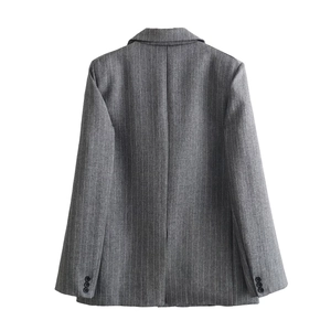 Rear view of a grey pinstripe wool-blend blazer jacket with back slit and button details