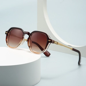 Modern narrow frame sunglasses with brown gradient lenses and gold metal temple accents