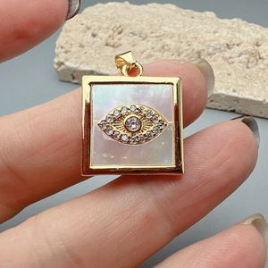 Golden square evil eye pendant necklace with diamond accents and mother of pearl inlay