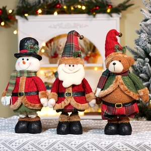 Detail of Christmas plush figurines featuring Santa, Snowman, and Bear with knit fabrics