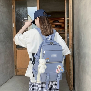 Blue and white school backpack with cute bear charm and pins for girls and students