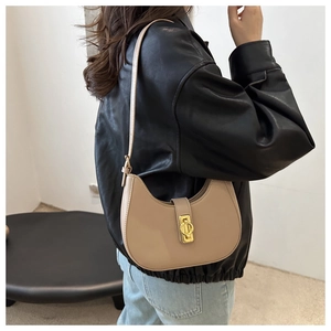 Chic beige hobo underarm bag for women with round silhouette and gold metal buckle