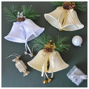 Detail of velvet Christmas ornaments with pine needles, cones and golden double bells
