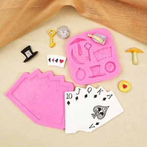 Silicone fondant mold with magic theme shapes including poker cards, clock, and top hat
