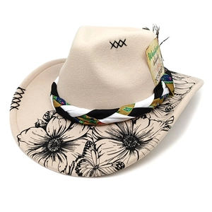 Detail of wool felt western hat with floral butterfly print and black feather accessory