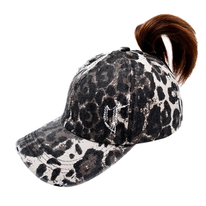 Detailed side view of leopard print baseball cap featuring high ponytail opening design