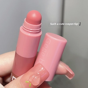Macro shot of a pink matte crayon lipstick showing its velvet tip and portable design
